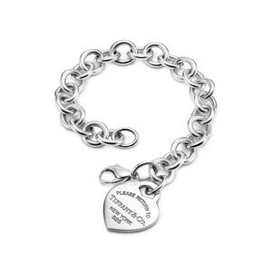 Tiffany & Co. “Return to Tiffany® Heart Tag Charm Bracelet in Silver